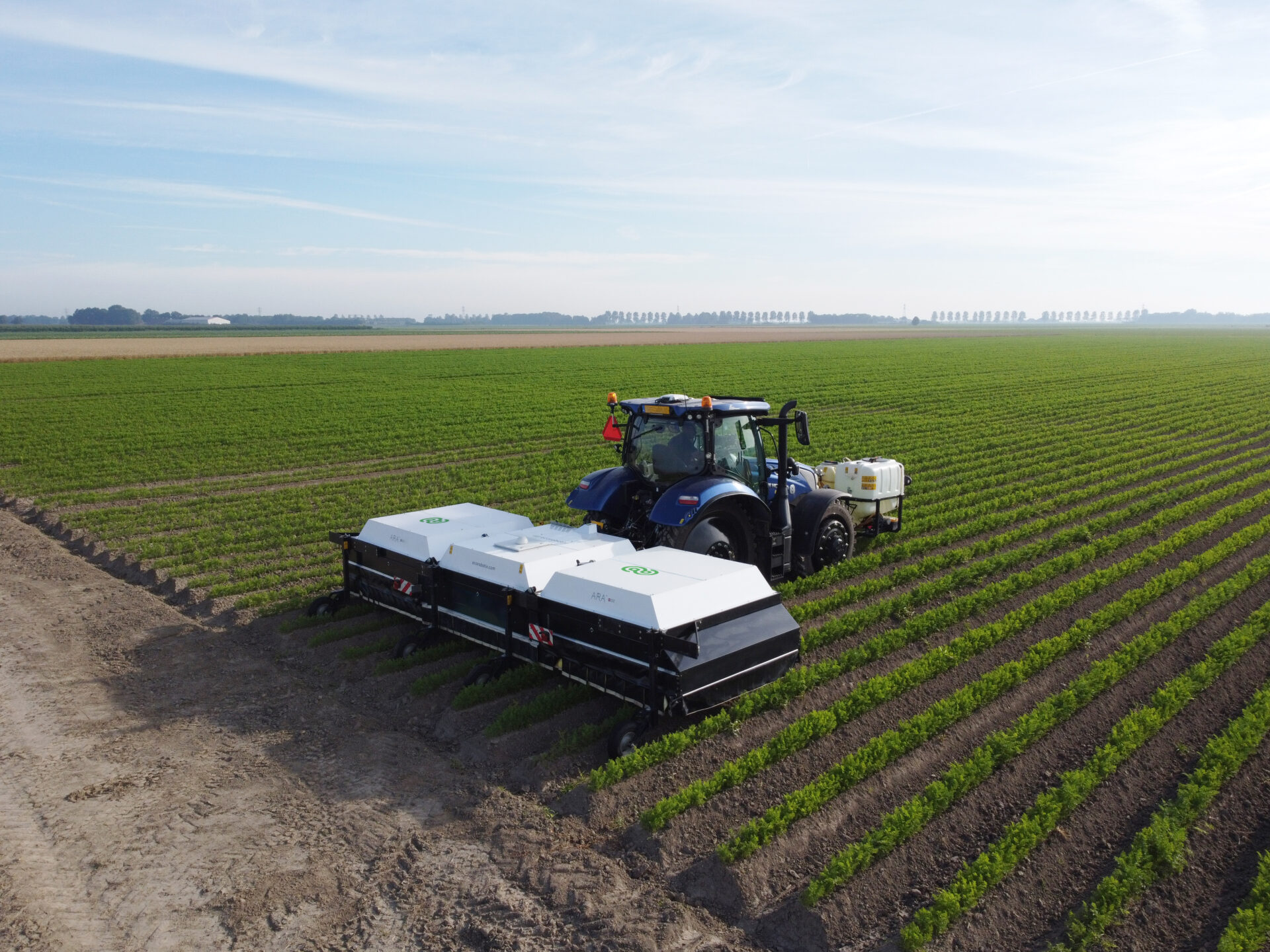 ARA field sprayer by Ecorobotix in carrot field