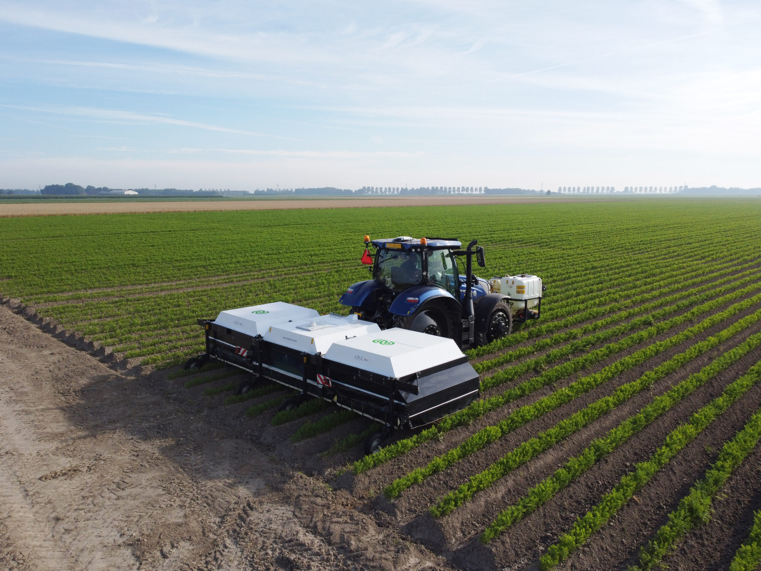 ARA field sprayer by Ecorobotix in carrot field